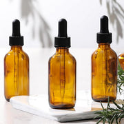 4 Pack 1 oz Glass Dropper Bottles with Measured Dropper - 30ml Dark Amber Tincture Bottles with Graduated Calibrated Glass Eye Droppers (1ml) for Essential Oils, Liquids - Leakproof Travel Bottles